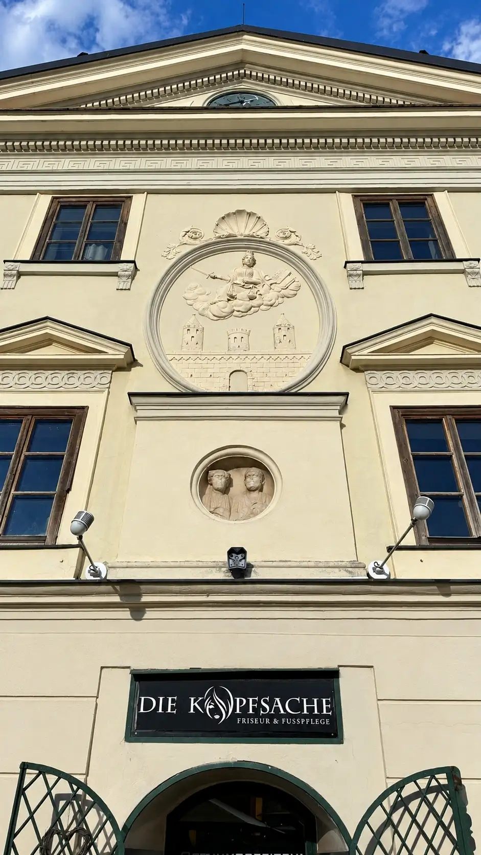 Top to bottom: gable pediment; crowning cornice; Justitia relief; Roman medallion
